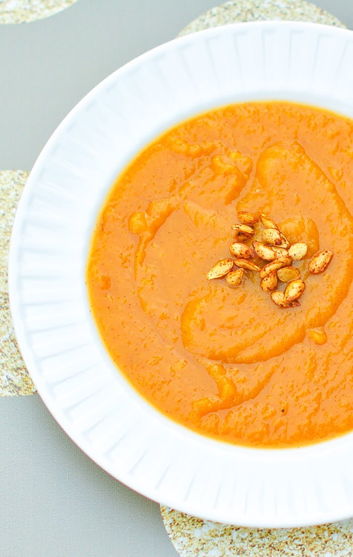 Smooth and creamy roasted butternut squash sweet potato soup is the perfect way to start your Thanksgiving meal! via JessicaLevinson.com #SweetPotatoSoup #SquashSoup #FallSoupRecipes Close Up of Butternut Squash and Sweet Potato Soup