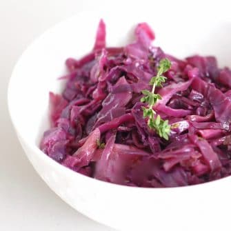 close up side view of braised red cabbage and apples