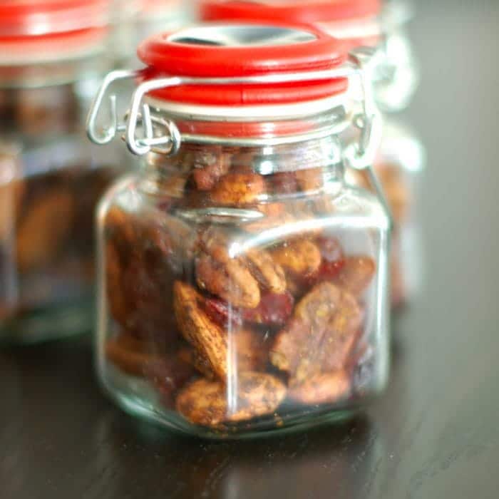 Sweet and Spicy Orange-Scented Nuts are a delicious homemade holiday gift, addition to a cocktail party spread, or anytime snack. Get the gluten-free, dairy-free, vegetarian recipe at JessicaLevinson.com | #EdibleGifts #SpicedNutsRecipe Orange-Scented Nuts in a Gift Jar