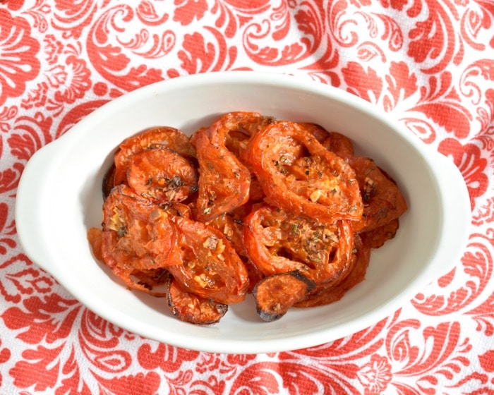 roasted tomatoes ready to serve roasted tomatoes in white ramekin