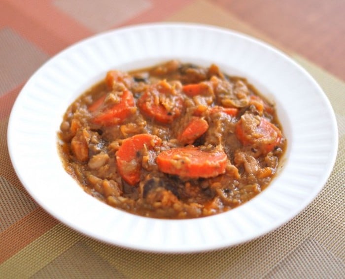 Warm up with a bowl of gluten-free and dairy-free hearty beef and vegetable stew full of nutrients and umami flavor! Recipe via JessicaLevinson.com #BeefandVegetableStew #HeartBeefStewRecipe Hearty Beef and Vegetable Stew in White Bowl