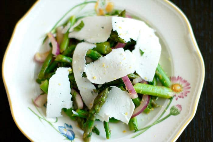 Earthy asparagus is tossed with crisp red onions, refreshing mint, zesty lemon, and salty ricotta salata cheese in this Asparagus Mint Salad that will get you in the spirit of spring and wake up your taste buds. Get the vegetarian and gluten-free recipe at JessicaLevinson.com #SpringRecipes #AsparagusSalad #SpringSalads Asparagus Mint Salad Close-Up