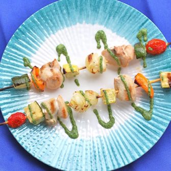 Veggie and protein-packed, these chicken kebabs with herb sauce are the perfect summer dinner on the grill! Get the gluten-free and dairy-free recipe @jlevinsonrd.
