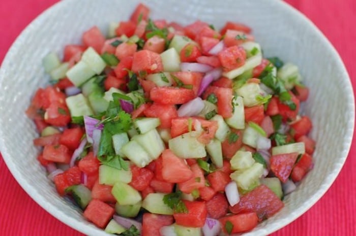 Flavorful and refreshing watermelon salsa is a fun summer twist on a classic. Serve with chips, over fish or beef tacos, on top of salads, or with grilled chicken. Get the gluten-free and vegan recipe at JessicaLevinson.com #WatermelonSalsaRecipe #SummerSalsa #SummerRecipes Watermelon Salsa in Bowl Close Up