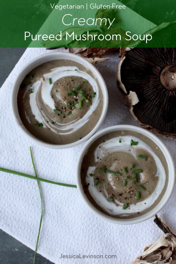 Satisfy your cravings for an umami-rich meal with this gluten-free and vegetarian thick and creamy pureed mushroom soup - no cream added! Get the recipe at JessicaLevinson.com | #mushroomsoup #mushroomrecipes #soup #mushroomaday creamy pureed mushroom soup topped with creme fraiche and chives