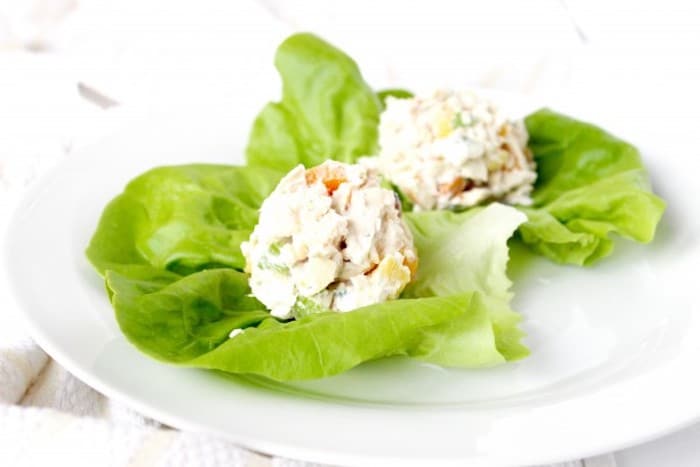 Switch up your regular chicken salad with this Apricot Pineapple Chicken Salad lightened up with Greek yogurt. Recipe via JessicaLevinson.com #chickensalad #picnicfood Apricot Pineapple Chicken Salad Over Lettuce