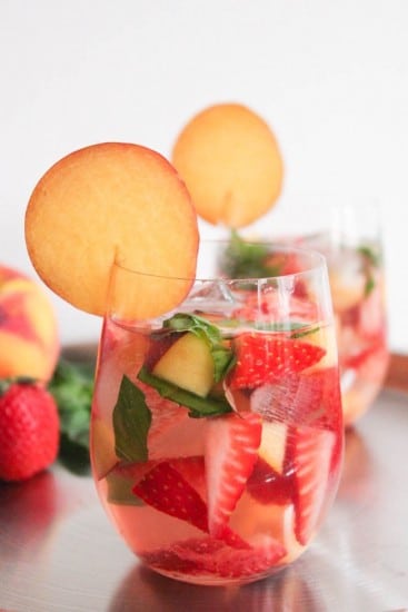 50+ delicious and healthy homemade picnic recipes that are perfect for enjoying the beautiful days of spring and summer outdoors with your family! Get the recipe roundup at JessicaLevinson.com #healthypicnicrecipes #picnicrecipes Rose Sangria @DomesticateMe