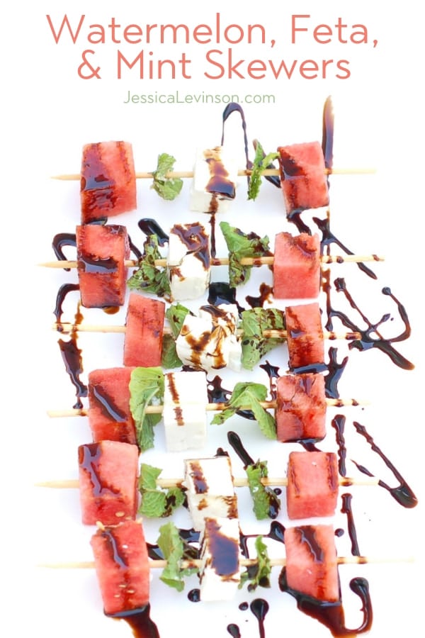Watermelon, Feta, and Mint Skewers are an easy, healthy, and refreshing sweet and savory appetizer for a summer party. Get the gluten-free, vegetarian recipe at JessicaLevinson.com | #summerfood #kidfriendlyfood #watermelonrecipes watermelon feta mint skewers drizzled with aged balsamic vinegar
