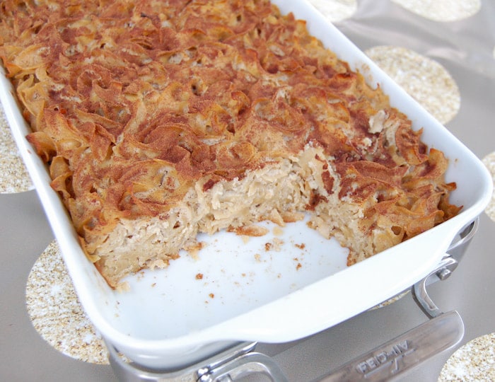 Passed down for generations, Cinnamon Apple Noodle Kugel is a sweet and comforting side dish the whole family loves, especially with my healthier twists cut Cinnamon Apple Noodle Kugel in casserole pan