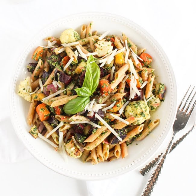 Roasted root vegetable pasta with pesto is a hearty and nutritious one-bowl meal. A perfect way to celebrate the flavors of the fall season. Recipe via JessicaLevinson.com #fallpastarecipe #vegetarianpasta #healthypastarecipe Overhead Bowl Roasted Root Vegetable Pasta