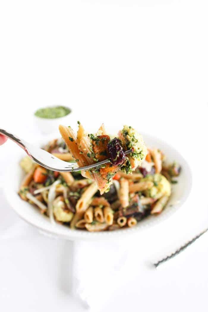 Roasted root vegetable pasta with pesto is a hearty and nutritious one-bowl meal. A perfect way to celebrate the flavors of the fall season. Recipe via JessicaLevinson.com #fallpastarecipe #vegetarianpasta #healthypastarecipe Forkful of Roasted Root Vegetable Pasta