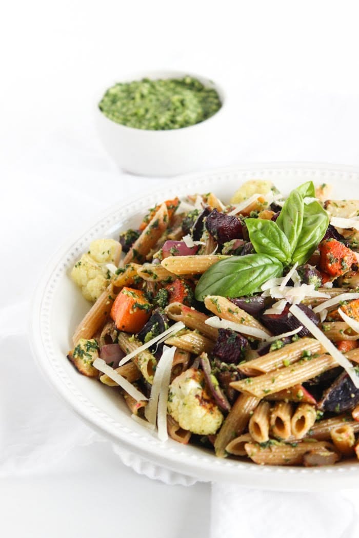 Roasted root vegetable pasta with pesto is a hearty and nutritious one-bowl meal. A perfect way to celebrate the flavors of the fall season. Recipe via JessicaLevinson.com #fallpastarecipe #vegetarianpasta #healthypastarecipe Bowl of Roasted Root Vegetable Pasta with Pesto