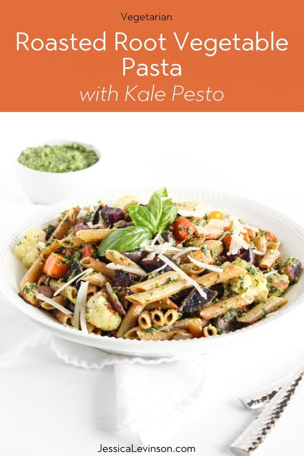 Roasted root vegetable pasta with pesto is a hearty and nutritious one-bowl meal. A perfect way to celebrate the flavors of the fall and winter season. Get the vegetarian recipe at JessicaLevinson.com | #rootvegetables #pasta #vegetarianrecipes Roasted root vegetable pasta with pesto with title overlay
