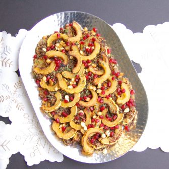 Maple-roasted delicata squash tops cider-infused quinoa and is garnished with thyme and pomegranate seeds in this easy, yet elegant side dish that's perfect for the holidays or any day of the week. Vegan, gluten-free, and nut-free recipe.