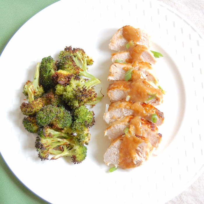 sliced miso glazed chicken with a side of roasted broccoli sliced miso glazed chicken with broccoli