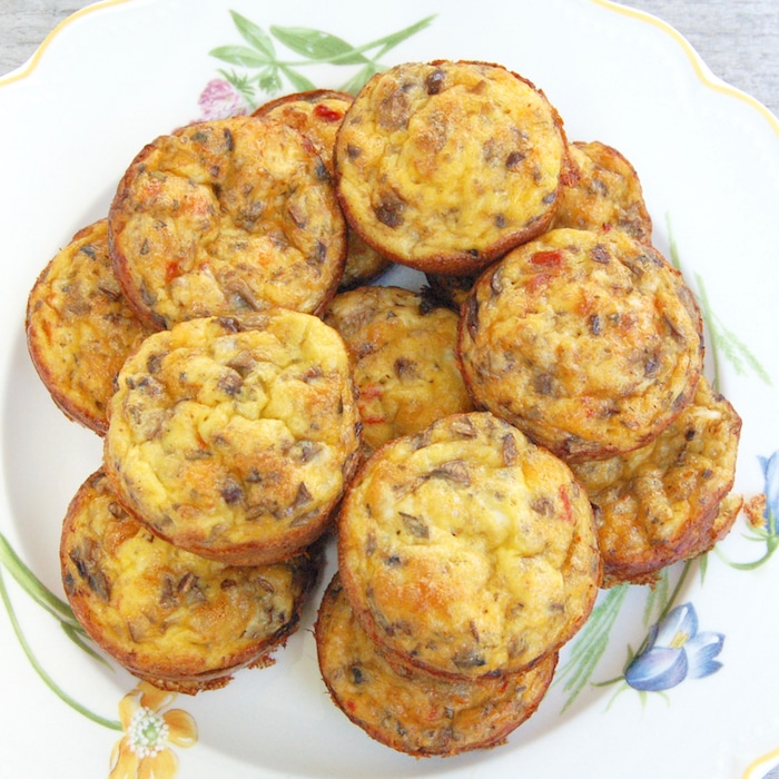 Veggie Egg Muffins are an easy make-ahead recipe perfect for breakfast on rushed mornings and the kids' lunchboxes. Easy, healthy, and totally customizable to your family's preferences! Recipe at JessicaLevinson.com | #eggmuffins #eggs #breakfast #lunch #kidfriendly #schoollunch #lunchbox #vegetarian #vegetarianrecipe #quickandeasy #freezerfriendly #makeaheadrecipe freezer friendly veggie egg muffins stacked on plate