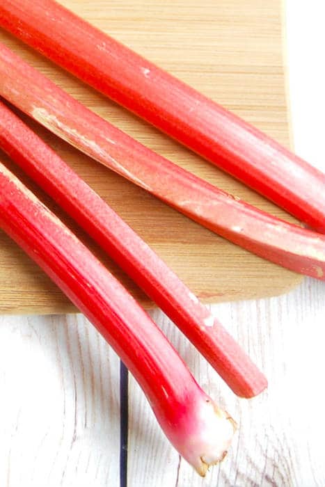 stalks of rhubarb stalks of rhubarb on cutting board