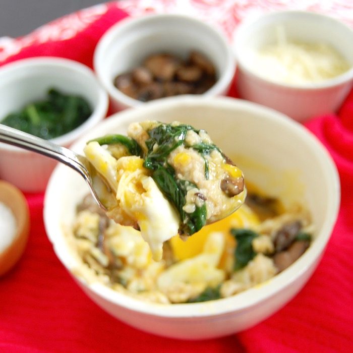 Enjoy a bite of this Savory Oatmeal Bowl with Spinach, Mushrooms, and Fried Egg spoonful of savory oatmeal breakfast bowl