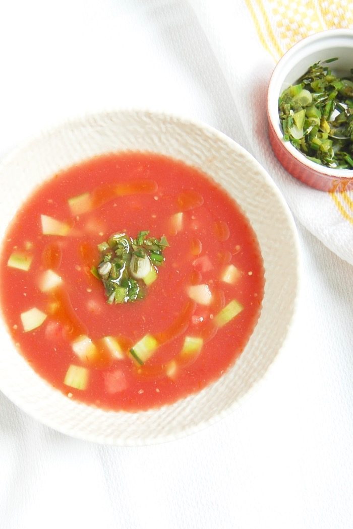 Enjoy the best flavors of summer by the spoonful with this Watermelon Tomato Gazpacho, a sweet and savory twist on the classic summer soup.Get the recipe at JessicaLevinson.com | #watermelongazpacho #SummerGazpachoRecipe Watermelon Tomato Gazpacho in White Bowl