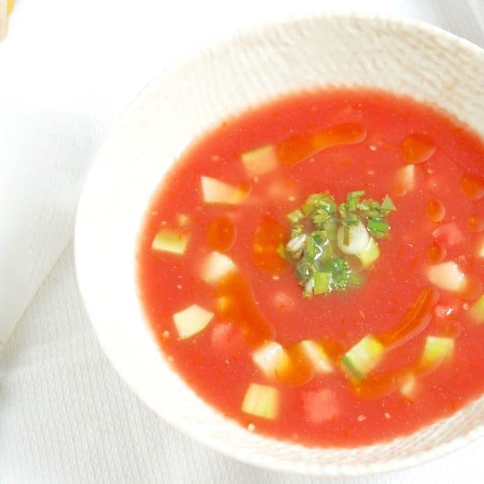 Enjoy the best flavors of summer by the spoonful with this Watermelon Tomato Gazpacho, a sweet and savory twist on the classic summer soup.Get the recipe at JessicaLevinson.com | #watermelongazpacho #SummerGazpachoRecipe Watermelon Tomato Gazpacho Close Up