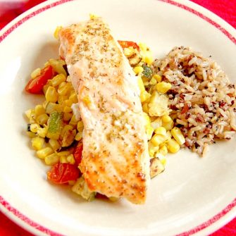 Mediterranean Sheet Pan Salmon with Zucchini, Corn, and Tomatoes is quick and easy to make and clean up. A perfect weeknight dinner for busy families. Get the recipe at JessicaLevinson.com | #glutenfree #dairyfree #eggfree #nutfree #salmon #recipe #sheetpanmeal #sheetpandinner #zucchini #corn #tomatoes #summerrecipes #summerveggies