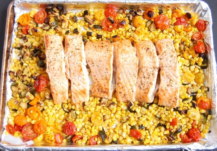 Mediterranean Sheet Pan Salmon with Zucchini, Corn, and Tomatoes | Jessica Levinson, MS, RDN, CDN Mediterranean Sheet Pan Salmon with Zucchini, Corn, and Tomatoes is quick and easy to make and clean up. A perfect weeknight dinner for busy families. Get the recipe at JessicaLevinson.com | #glutenfree #dairyfree #eggfree #nutfree #salmon #recipe #sheetpanmeal #sheetpandinner #zucchini #corn #tomatoes #summerrecipes #summerveggies