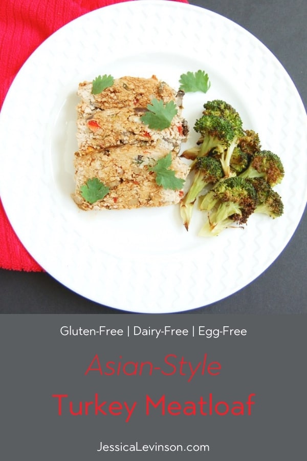 A twist on classic meatloaf, this Asian-style turkey meatloaf is loaded with vegetables, herbs and spices, and topped with a sweet and spicy glaze. #Meatloaf #asianfood #comfortfood #dairyfree #glutenfreerecipes #eggfree #kosher Asian-Style Turkey Meatloaf on plate with broccoli with title overlay
