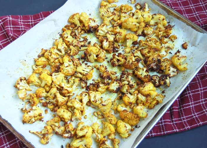 Turmeric Roasted Cauliflower turmeric roasted cauliflower on baking sheet