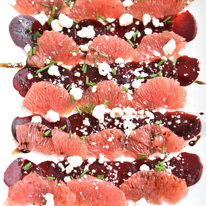 close up of beet & grapefruit carpaccio with goat cheese close up of beet & grapefruit carpaccio