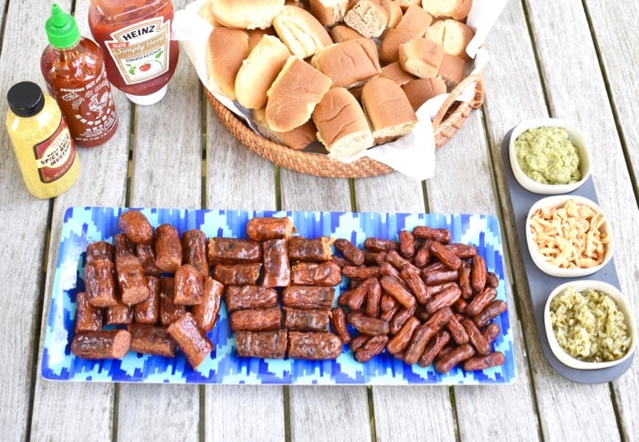 hot dog slider bar with all the fixings for summer barbecue overhead shot of hot dog slider bar for summer barbecue